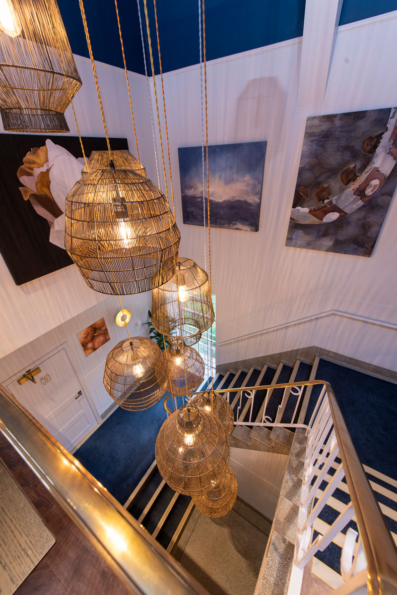 an image of a lighting design over a stairwell created by Flippa Interiors
