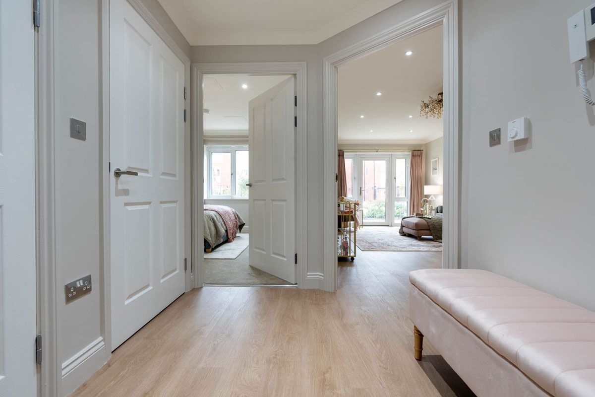 hallway-leading-to-blush-interior-design-scheme-for-1-bed-apartment
